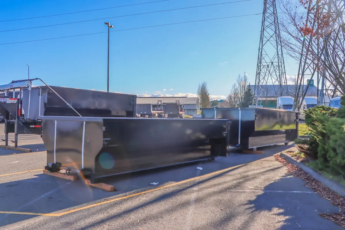 Roll-off dumpster ready for waste disposal at job site for Concrete Dumpster Rental in Ellwood City